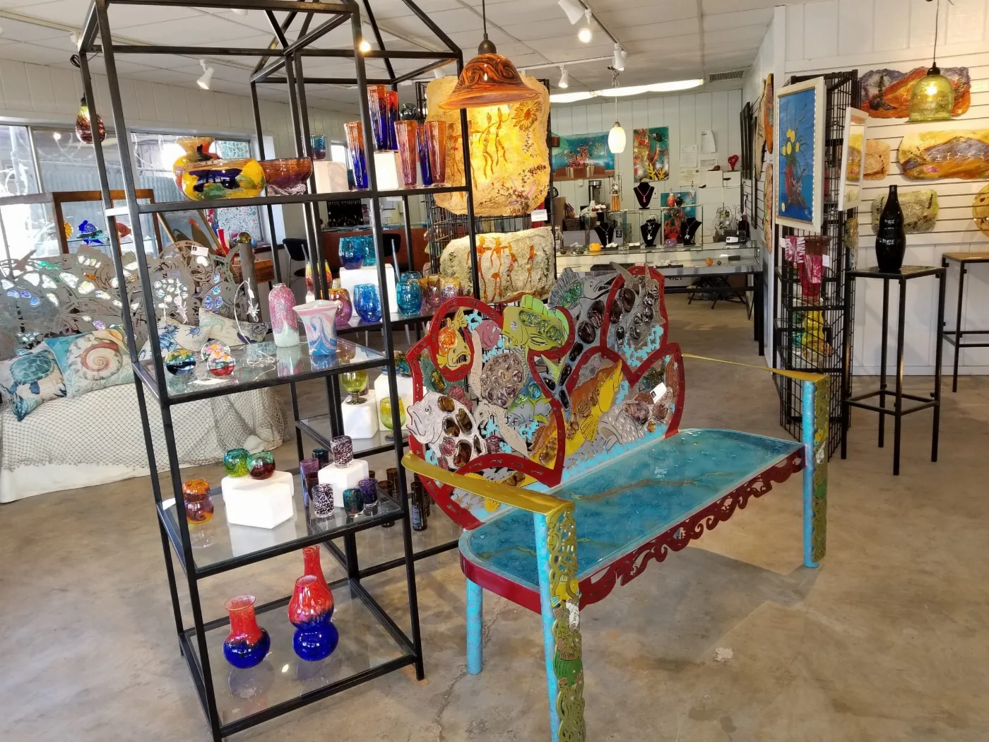 Colorful glass vessels, sculptures and art benches in the Stone and Glass gallery